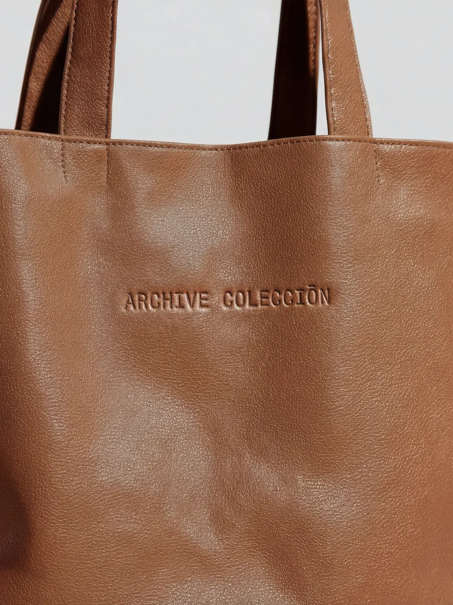 Leather tote with an embossed logo